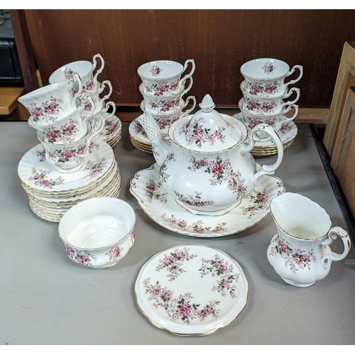 645 - A Royal Albert Lavender Rose Tea Service 12 x Cups, Saucers, Plates. Tea Pot, Milk Jug, Pot Stand, S... 