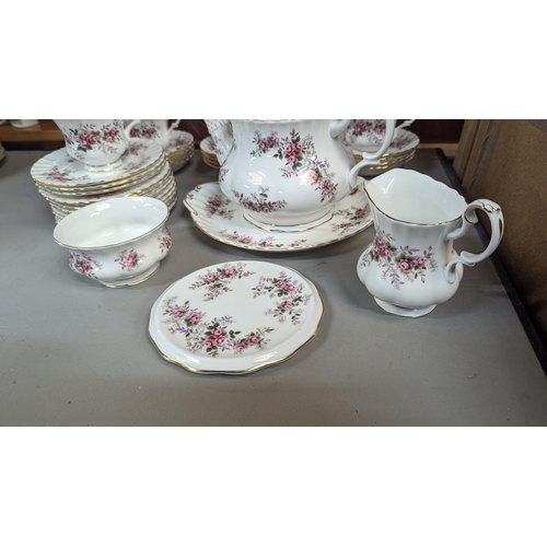 645 - A Royal Albert Lavender Rose Tea Service 12 x Cups, Saucers, Plates. Tea Pot, Milk Jug, Pot Stand, S... 