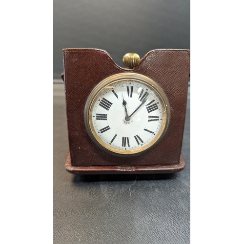 519 - An Antique Swiss 8 Day Travelling Clock in Leather Case