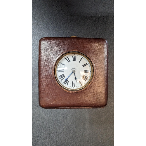 519 - An Antique Swiss 8 Day Travelling Clock in Leather Case