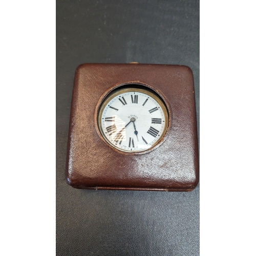 519 - An Antique Swiss 8 Day Travelling Clock in Leather Case