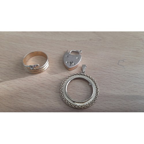 423 - A 9ct Gold Half Sovereign Pendant Holder, Lock and Snake Ring ( Missing Ruby eye) 7.35 Grams Total W... 