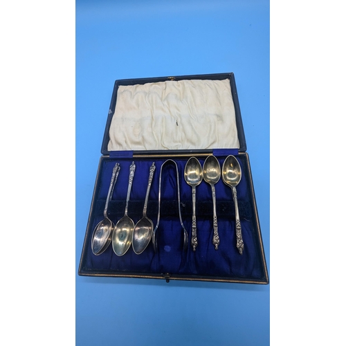 913 - A Cased EPNS Set of 9 x Spoons and Sugar Tongs