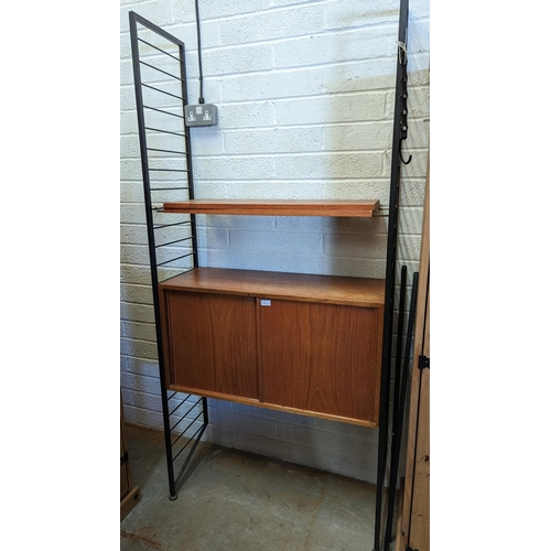 523 - Ladderax System Comprising of 2 x Uprights, A Sliding Cabinet and Shelves 94cm w x 200cm H