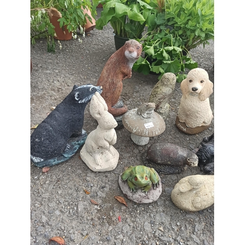 68 - Selection of Garden Ornaments including Otter, Owls, Dogs, Ducks, Badger Rabbit and Frogs  ( x 12)