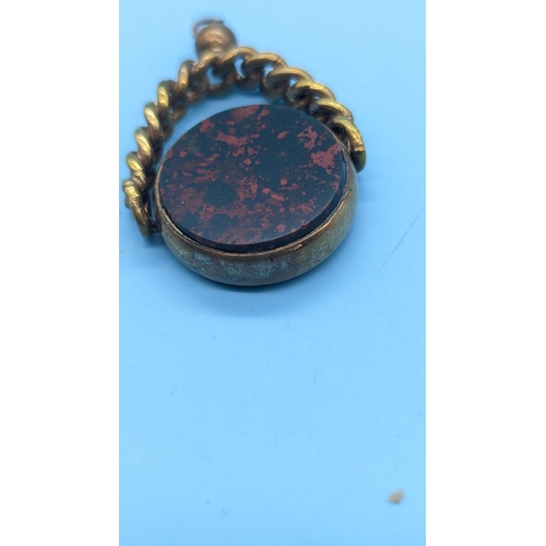 412 - A Large Gilt Carnelian / Blood Stone Rotating Watch Fob