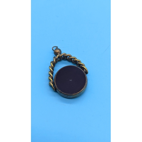 412 - A Large Gilt Carnelian / Blood Stone Rotating Watch Fob