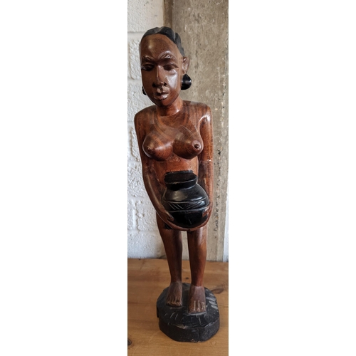 520 - A Carved Figurine of an African Lady Carrying a Pot 55cm Tall