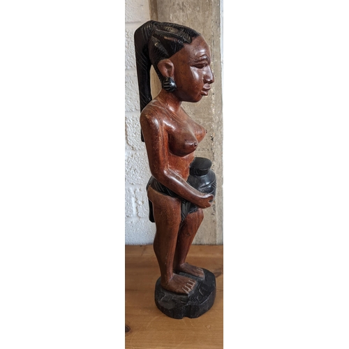 520 - A Carved Figurine of an African Lady Carrying a Pot 55cm Tall