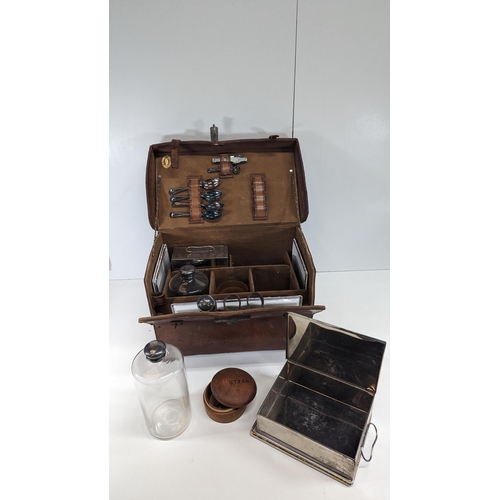 351 - An Edwardian Leather Picnic Hamper