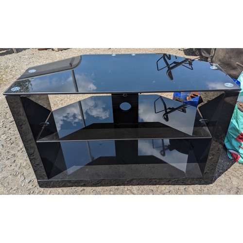 284 - A Black Glass TV Unit