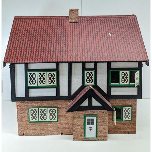 845 - A Tudor Style Dolls House with Lighting and Accessories