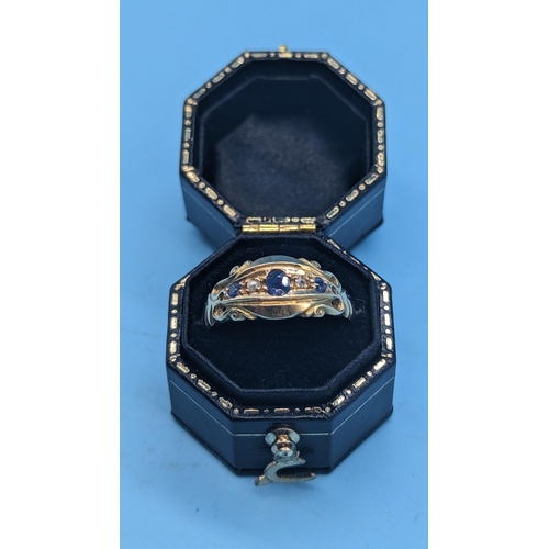 433 - An 18ct Yellow Gold, Diamond and Sapphire Ring. 3gms. Size R