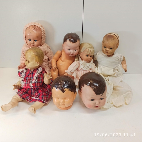 837 - An Assortment Of Antique And Vintage Dolls And Dolls Parts. Various Compositions.