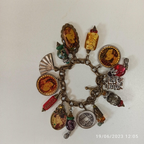 742 - A Chinese Themed Charm Bracelet, made by 