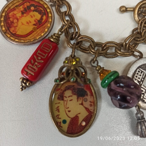 742 - A Chinese Themed Charm Bracelet, made by 