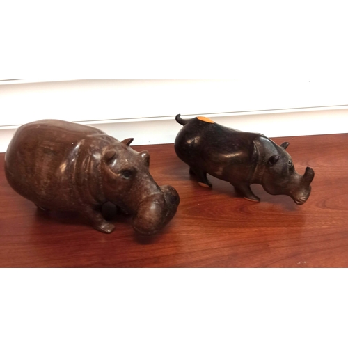 1244 - A Carved Wooden Hippo and Rhino