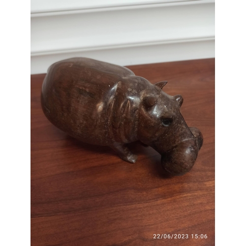 1244 - A Carved Wooden Hippo and Rhino