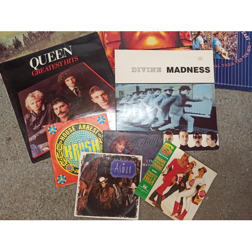 725 - Assorted 80's & 90's LP's 12inch and 7inch including Queen and Madness