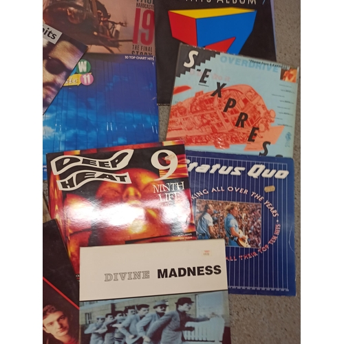 725 - Assorted 80's & 90's LP's 12inch and 7inch including Queen and Madness