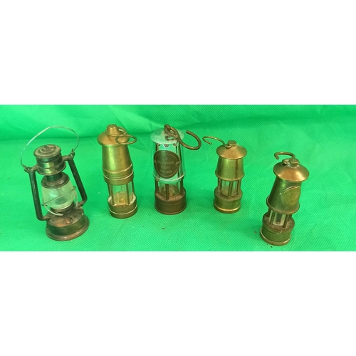 1298 - A Selection of Miniature Davey Miners lamps