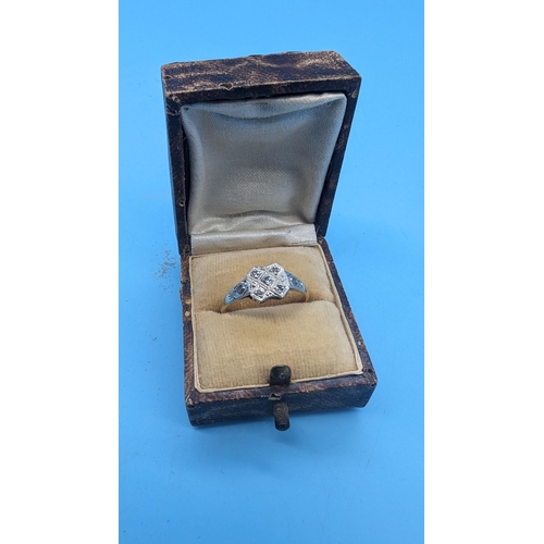 403 - An 18ct Platinum and Diamond Ring 2.19 Grams