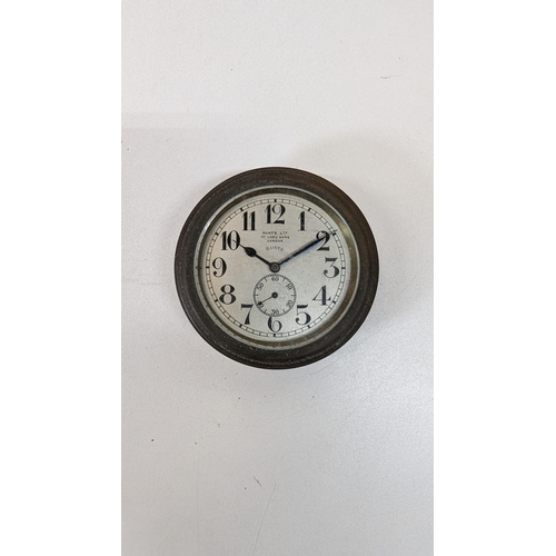 482B - A Hunts of London 8 Day Brass Clock - 8cm Diameter