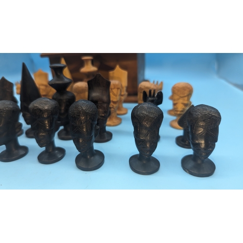 855 - Carved  African Head Chess Pieces in Puzzleware Wooden Box