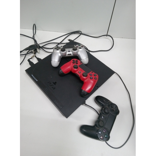 829H - A Playstation 4 with 3 x Controllers