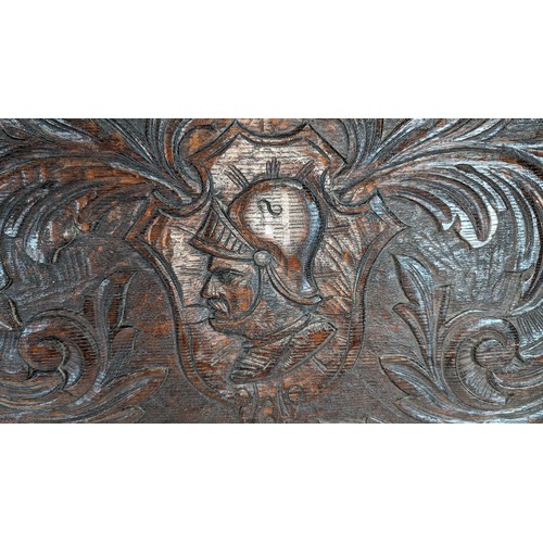 353 - A Carved knight Oak Panel 110 x 48cm