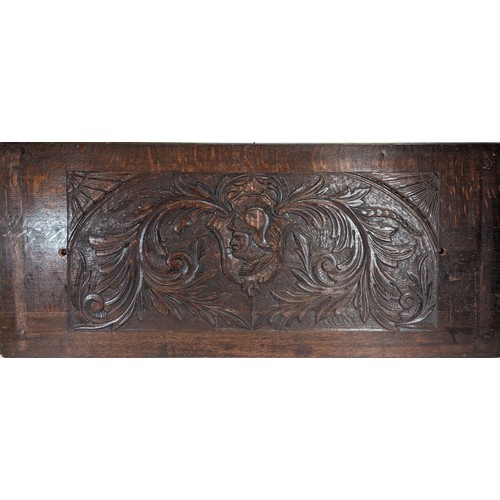 353 - A Carved knight Oak Panel 110 x 48cm