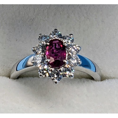 416 - 18ct white gold ruby and diamond cluster ring.  Ruby 0.50ct Diamonds 0.50ct.  Boxed - Ring Size M