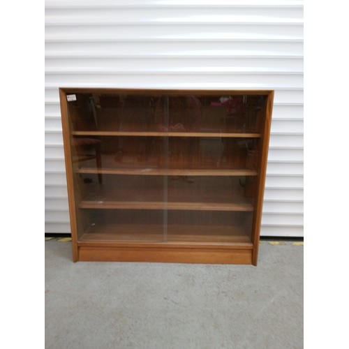 692 - Mid Century Bookcase with Glass Sliding Doors and Adjustable Shelves 84cm H x 91cm W, x 24cm D