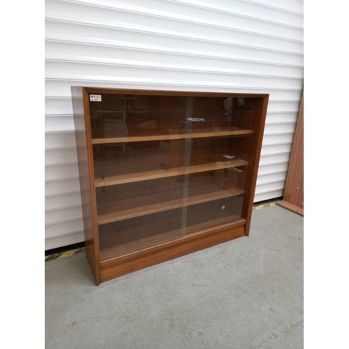 693 - Mid Century Bookcase with Glass Sliding Doors and Adjustable Shelves 84cm H x 91cm W, x 24cm D