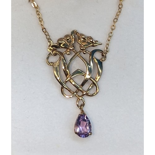 414 - Art nouveau style 9ct yellow gold necklace set with a pear shaped amethyst on a 9ct yellow gold chai... 