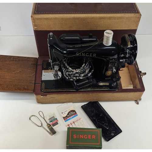 749 - An Electric Singer Sewing Machine with Light