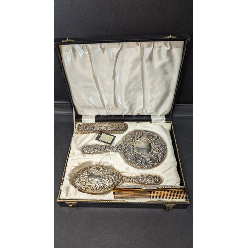 813 - A Boxed and Hallmarked Silver Vanity Set.