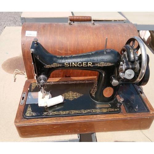 651 - Singer Sewing Machine In Wooden Case with Key.