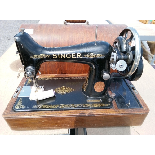 651 - Singer Sewing Machine In Wooden Case with Key.