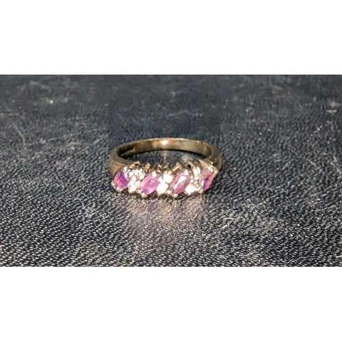 772 - A 9ct Gold Amethyst and Diamond Ring.2.9gms.
Ring Size M