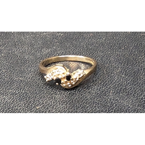 773 - A 9ct Gold Ring with Diamond and Sapphire Accents.
Ring Size 773