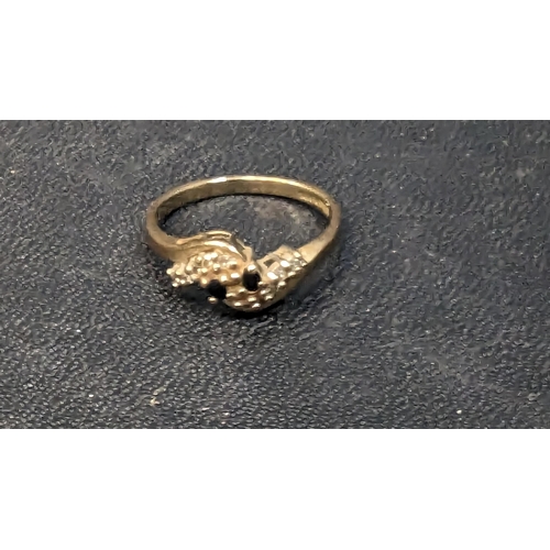 773 - A 9ct Gold Ring with Diamond and Sapphire Accents.
Ring Size 773