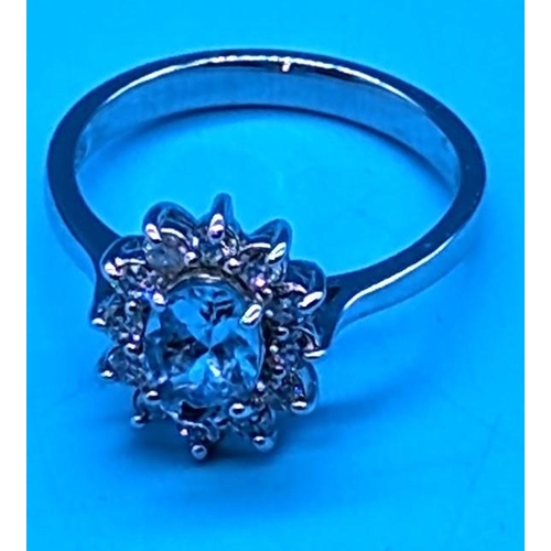 758 - 18ct white gold oval aquamarine and RBC diamond cluster ring.  Aquamarine 0.80ct.  Diamonds 0.30ct
R... 