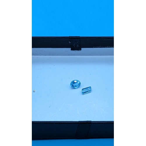 759 - Two unmounted aquamarine gemstones.  2.66ct [1.68ct oval / 0.98ct parallelogram]