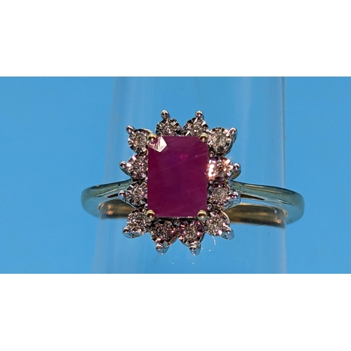 747 - 9ct yellow gold ring set with step cut natural treated ruby and round cut diamond cluster ring.  Rub... 