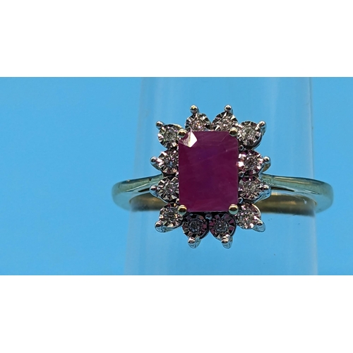 747 - 9ct yellow gold ring set with step cut natural treated ruby and round cut diamond cluster ring.  Rub... 