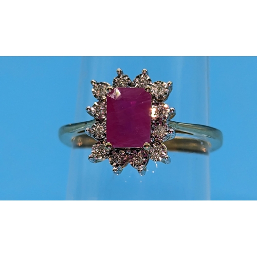 747 - 9ct yellow gold ring set with step cut natural treated ruby and round cut diamond cluster ring.  Rub... 