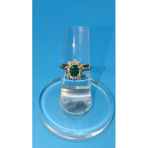 784 - Certificated 18ct yellow and white gold oval emerald and diamond cluster ring.  Emerald 0.80ct.  Dia... 