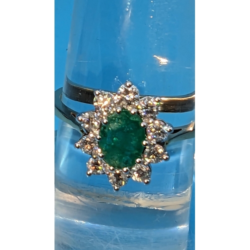 784 - Certificated 18ct yellow and white gold oval emerald and diamond cluster ring.  Emerald 0.80ct.  Dia... 