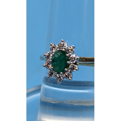 784 - Certificated 18ct yellow and white gold oval emerald and diamond cluster ring.  Emerald 0.80ct.  Dia... 